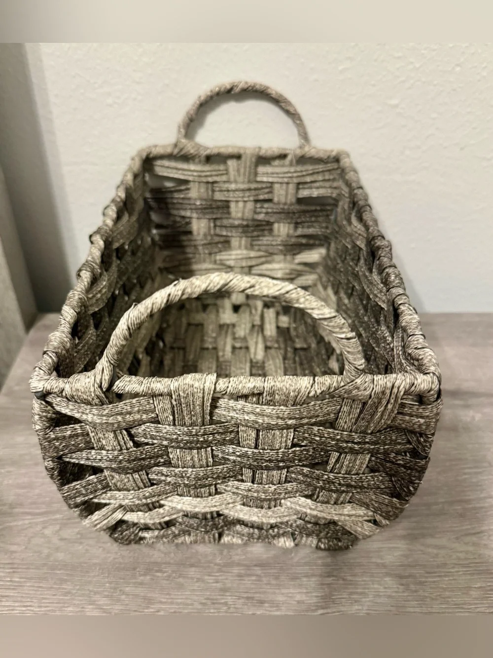 Allen +Roth . This small, grey decorative basket by allen + roth is made of poly